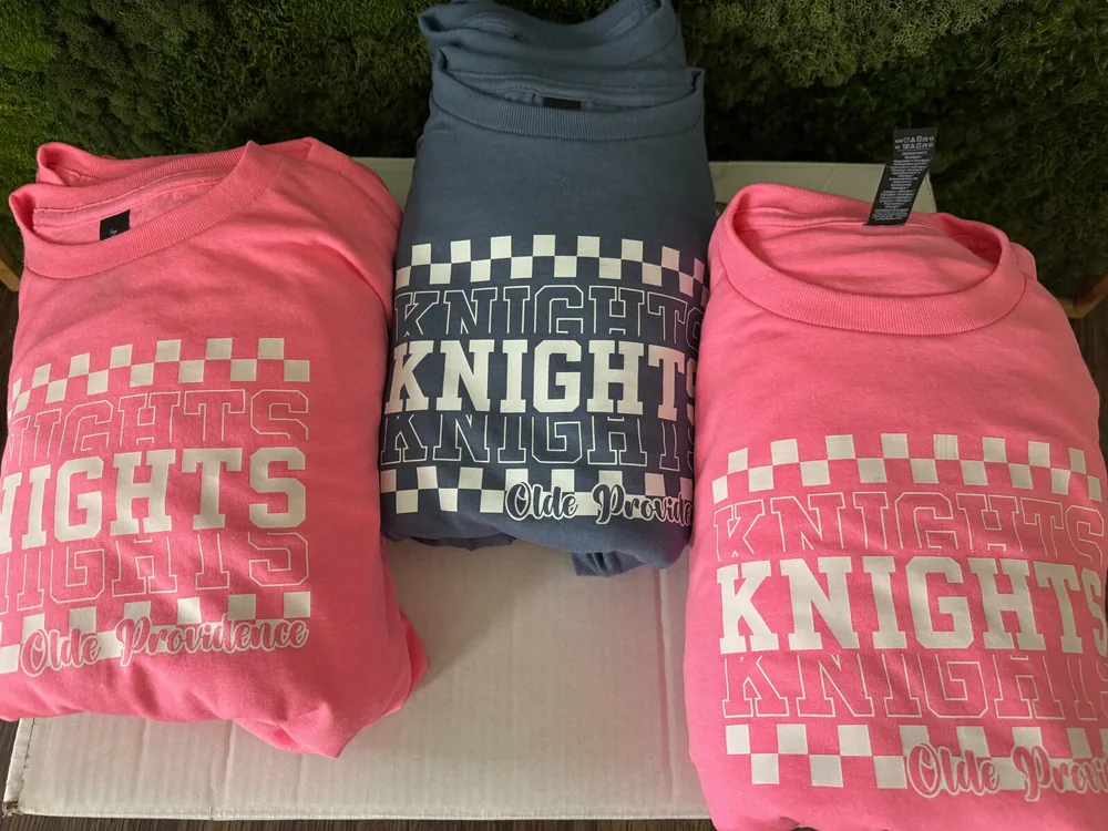 Custom Olde Providence Knights retro checkered t-shirts in pink and blue